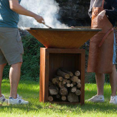 Le feu en acier rouillé Pit Outdoor With Wood Storage de la taille 100cm Corten
