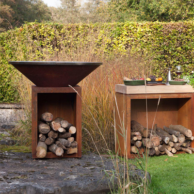 Le feu en acier rouillé Pit Outdoor With Wood Storage de la taille 100cm Corten